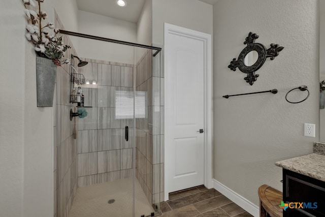 588 Vale Ct, New Braunfels, TX 78132 - bathroom featuring an enclosed shower, vanity, and wood-type flooring