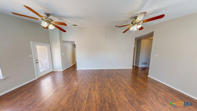 unfurnished living room featuring dark hardwood / wood-style floors and vaulted ceiling