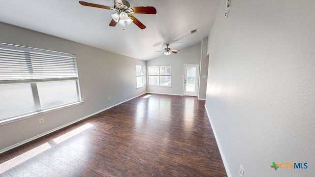 unfurnished room featuring hardwood / wood-style floors, vaulted ceiling, and ceiling fan