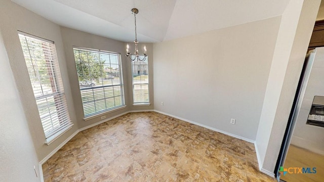 unfurnished dining area with plenty of natural light, lofted ceiling, and an inviting chandelier