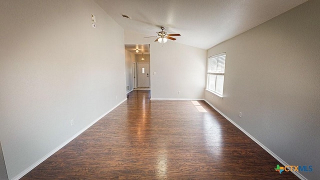 spare room featuring ceiling fan, dark hardwood / wood-style flooring, and lofted ceiling