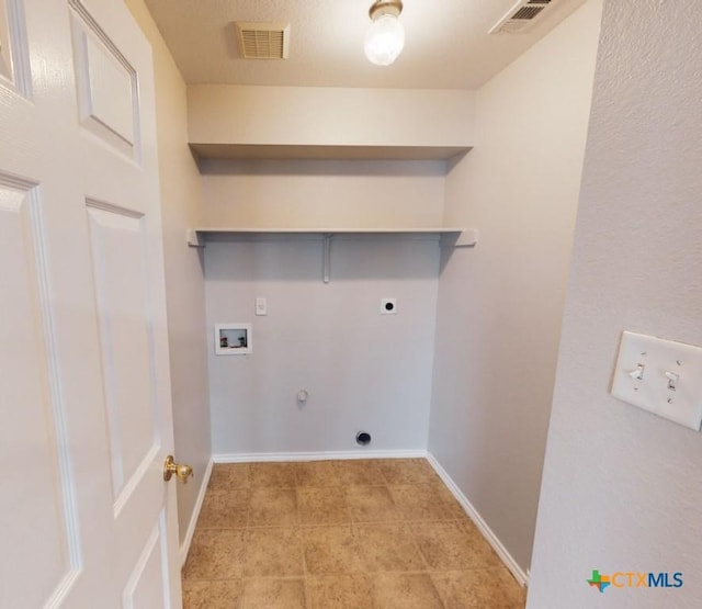 clothes washing area with hookup for an electric dryer, gas dryer hookup, and hookup for a washing machine