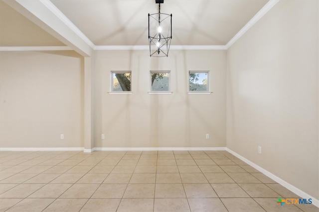 tiled empty room with a healthy amount of sunlight, a notable chandelier, and ornamental molding