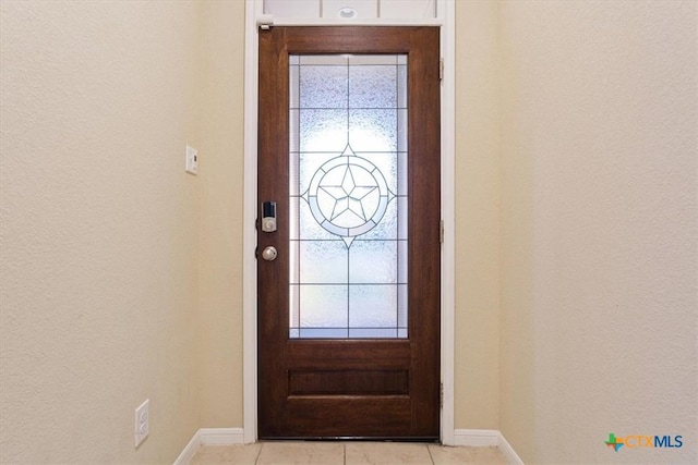 212 Lasata Ln, Belton, TX 76513 - entryway with baseboards, plenty of natural light, light tile patterned floors, and a textured wall