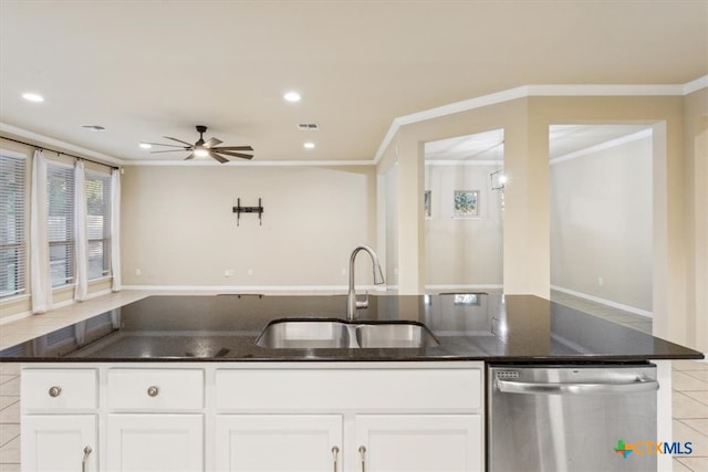 kitchen with crown molding, sink, white cabinets, dishwasher, and dark stone countertops