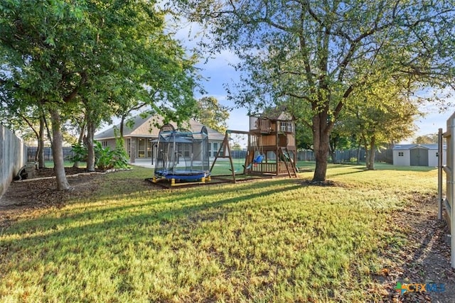 212 Lasata Ln, Belton, TX 76513 - view of yard featuring a trampoline, a playground, a shed, and an outbuilding