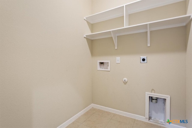 clothes washing area with washer hookup, electric dryer hookup, tile patterned floors, and hookup for a gas dryer