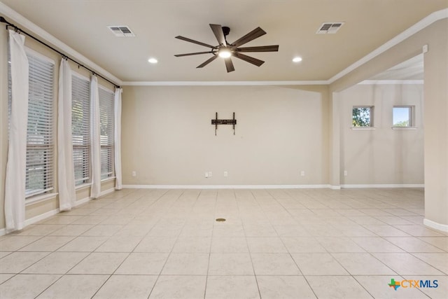 spare room featuring ceiling fan, plenty of natural light, and ornamental molding