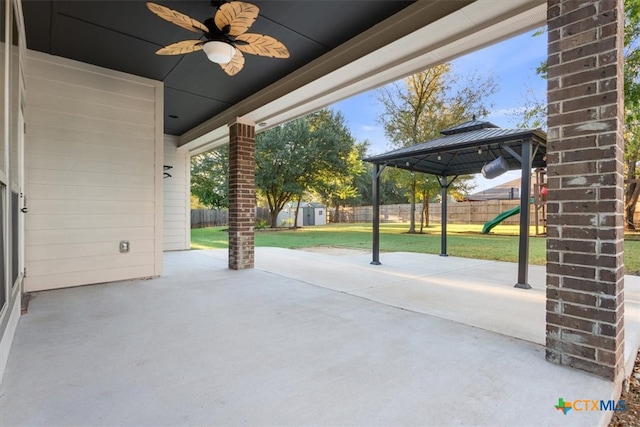 view of patio featuring ceiling fan and a gazebo