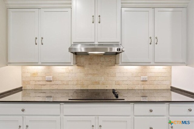 212 Lasata Ln, Belton, TX 76513 - kitchen featuring extractor fan, decorative backsplash, and white cabinets