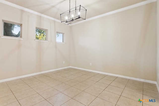 spare room with a chandelier, crown molding, and light tile patterned flooring