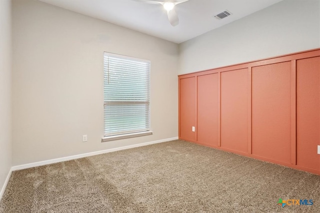 unfurnished bedroom featuring carpet flooring and ceiling fan