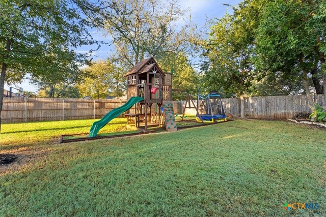 view of playground with a yard