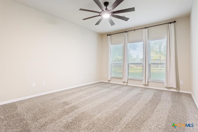 empty room with carpet flooring and ceiling fan