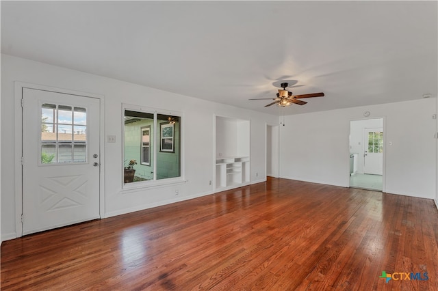 unfurnished living room with ceiling fan and hardwood / wood-style flooring