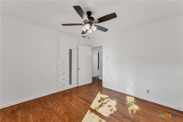 unfurnished bedroom featuring hardwood / wood-style flooring and ceiling fan