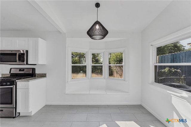 kitchen with white cabinetry, plenty of natural light, pendant lighting, and appliances with stainless steel finishes