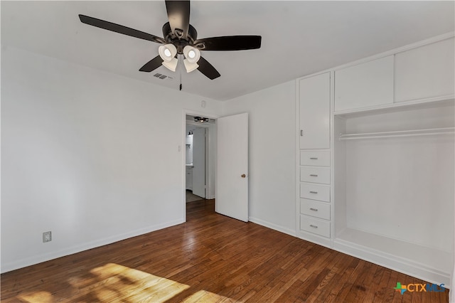 unfurnished bedroom with ceiling fan, a closet, and dark hardwood / wood-style floors