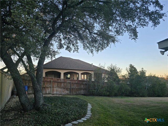 view of front of home with a lawn