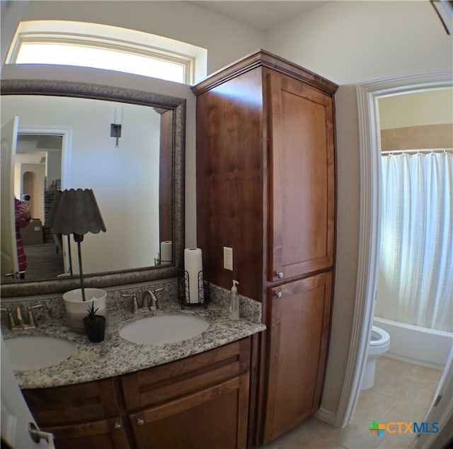 full bathroom with vanity, shower / tub combo, tile patterned floors, and toilet