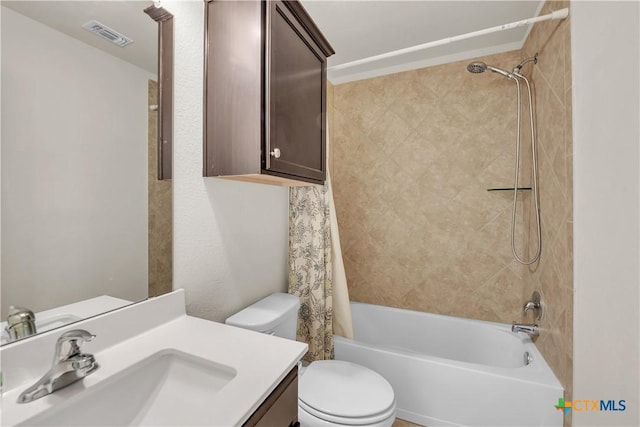 full bath featuring visible vents, shower / tub combo with curtain, vanity, and toilet