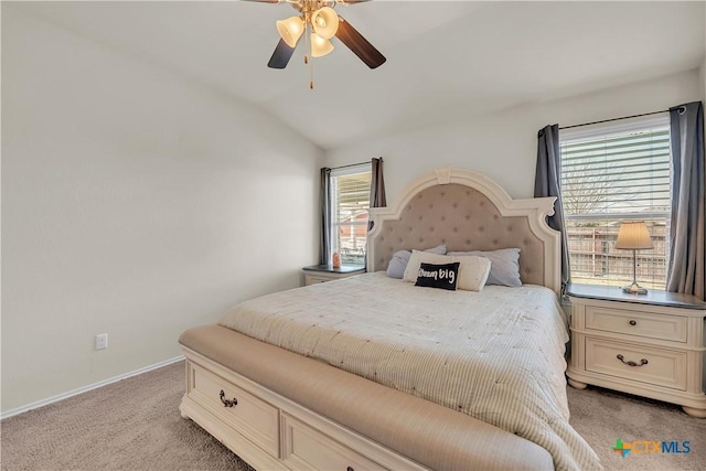 bedroom with lofted ceiling, light carpet, ceiling fan, and baseboards