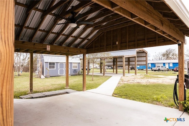 view of patio with an outbuilding