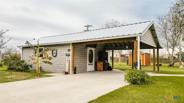 exterior space with a yard and a storage unit