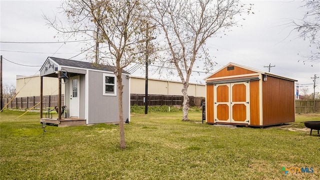 view of outbuilding featuring a lawn