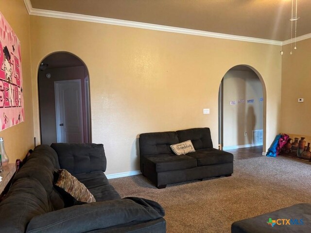 9604 Diana Dr, Killeen, TX 76542 - carpeted living room featuring arched walkways, crown molding, and baseboards