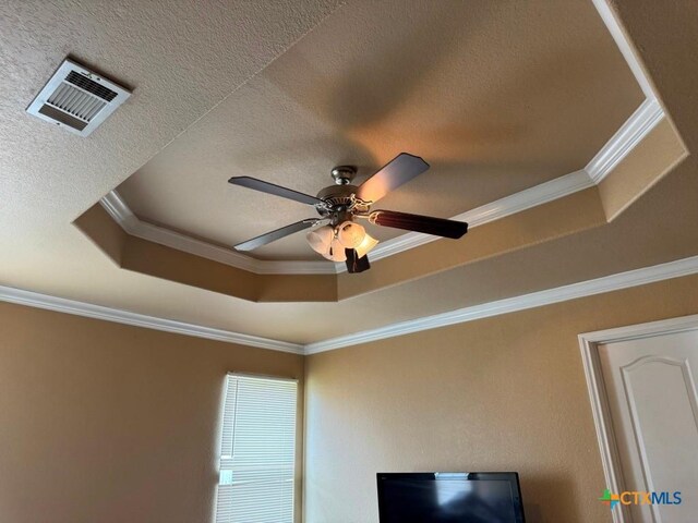 9604 Diana Dr, Killeen, TX 76542 - detailed view of a textured ceiling, a ceiling fan, ornamental molding, and a raised ceiling