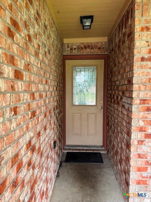 9604 Diana Dr, Killeen, TX 76542 - property entrance featuring brick siding and covered porch