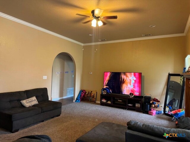 9604 Diana Dr, Killeen, TX 76542 - living area with arched walkways, a ceiling fan, crown molding, carpet flooring, and baseboards