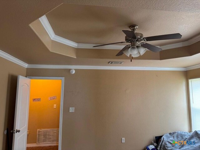 9604 Diana Dr, Killeen, TX 76542 - unfurnished bedroom with ornamental molding, a raised ceiling, ceiling fan, and tile patterned flooring