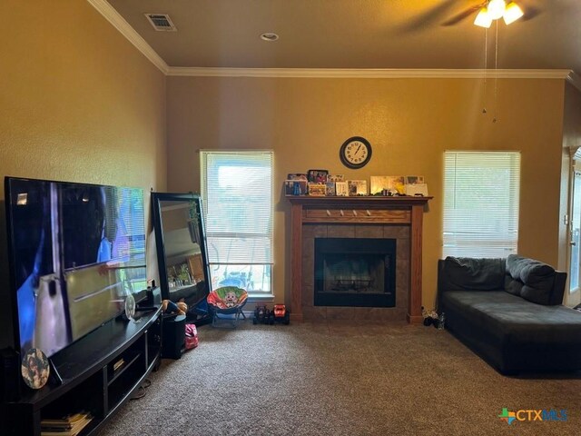 9604 Diana Dr, Killeen, TX 76542 - living room featuring carpet floors, a tile fireplace, a ceiling fan, and ornamental molding