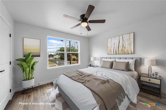 1005-1015 S 26th St, Temple, TX 76501 - bedroom with wood finished floors, baseboards, and ceiling fan