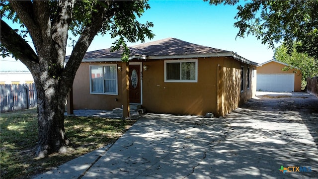 bungalow featuring a garage