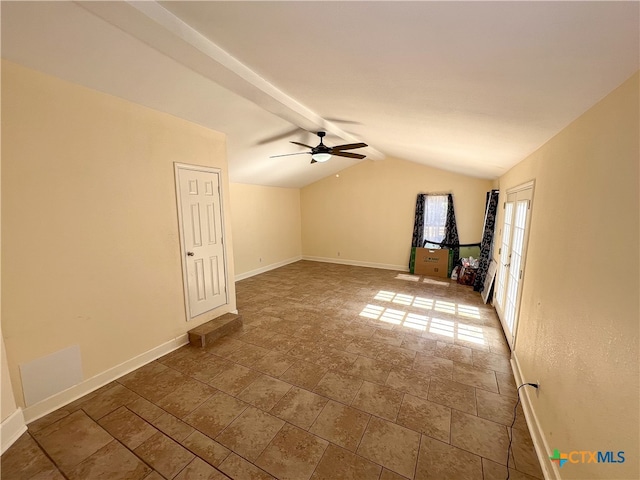 unfurnished living room with lofted ceiling with beams and ceiling fan