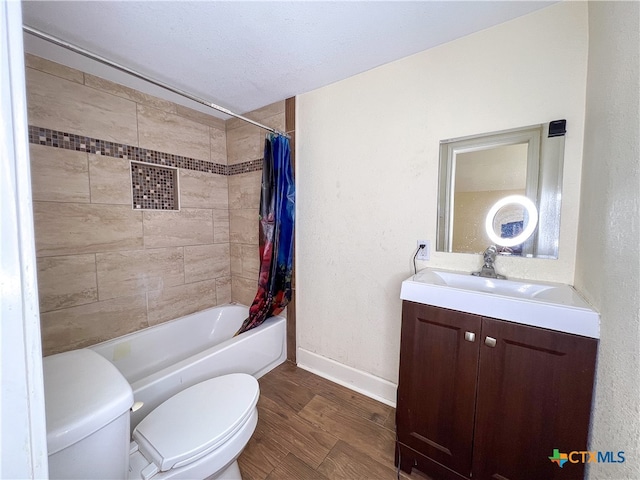 full bathroom with wood-type flooring, toilet, a textured ceiling, vanity, and shower / bathtub combination with curtain