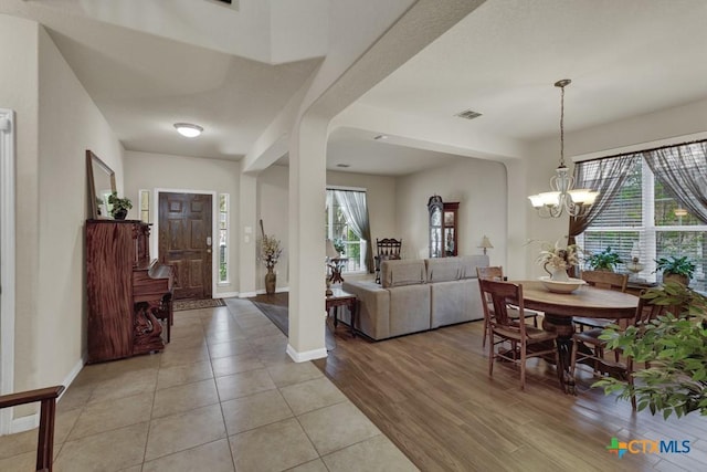 1104 Magellan, Windcrest, TX 78239 - foyer with baseboards, a chandelier, and light wood-type flooring