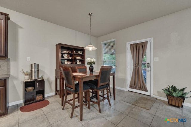 1104 Magellan, Windcrest, TX 78239 - dining area featuring light tile patterned flooring and baseboards