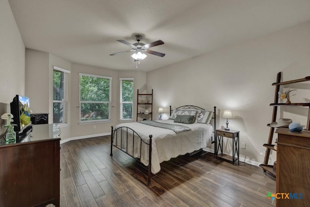 1104 Magellan, Windcrest, TX 78239 - bedroom featuring dark wood-style flooring, baseboards, and ceiling fan
