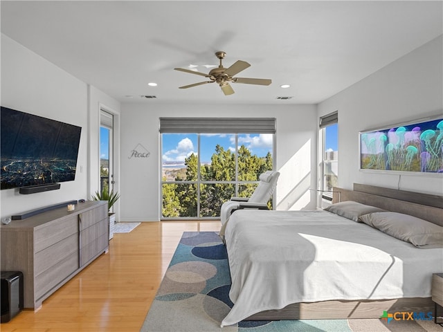 bedroom with a ceiling fan, visible vents, recessed lighting, access to outside, and light wood-type flooring