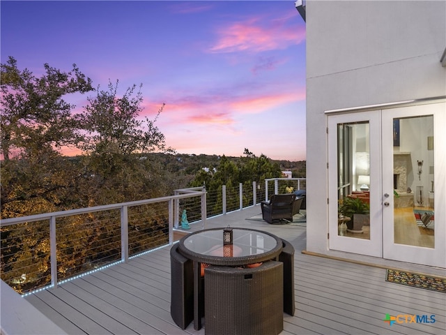 deck at dusk with french doors