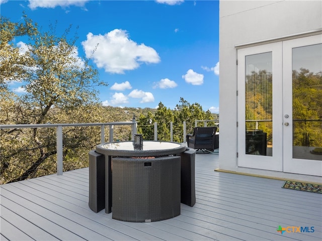 wooden deck featuring french doors