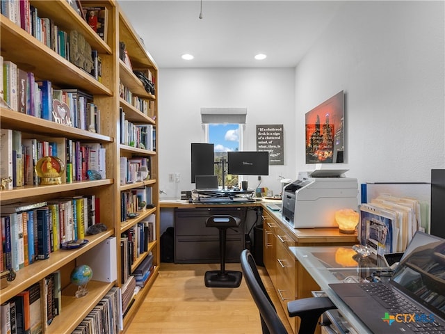 office with recessed lighting and light wood finished floors