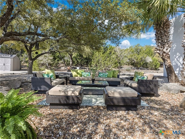 view of patio with an outbuilding, an outdoor hangout area, and a storage shed