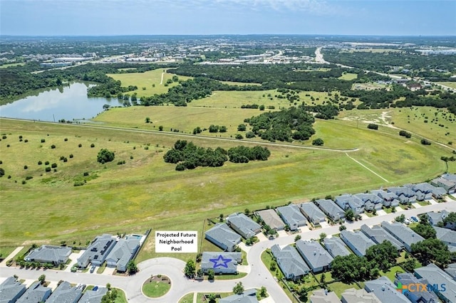 drone / aerial view featuring a residential view and a water view