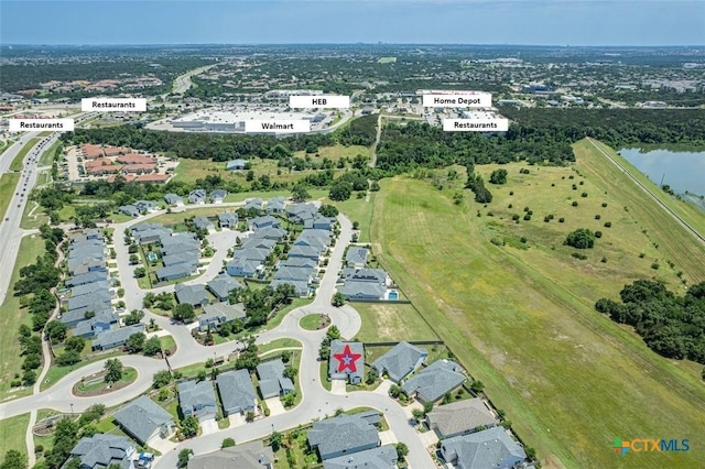 aerial view featuring a water view and a residential view