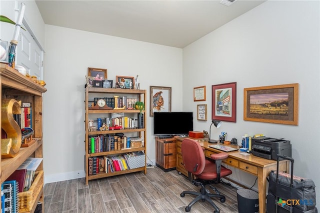 home office featuring wood tiled floor and baseboards